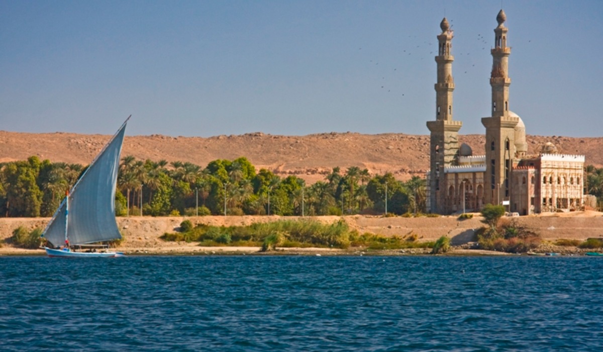 A traditional felucca sails on the nile river