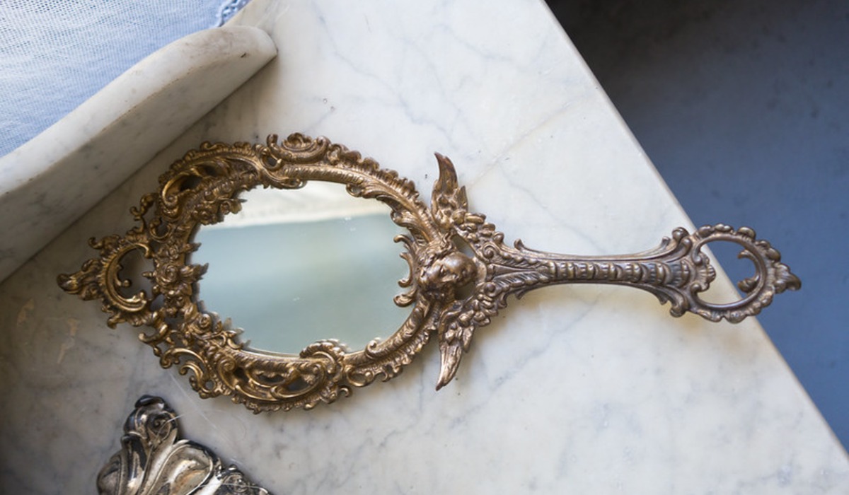 pink and yellow hand mirror