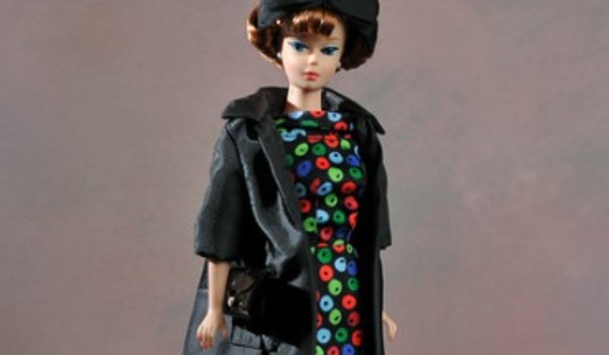 a woman wearing a black hat and a black jacket