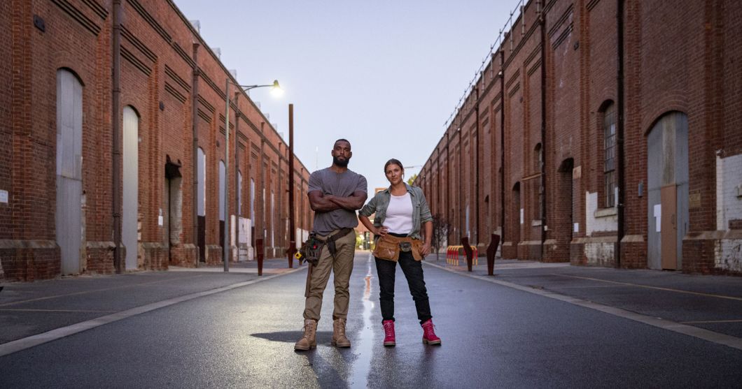 Two people standing in the middle of the road while wearing the Southern Cross Zip Scuff Sand boots and Southern Cross Zip Ladies Pink boots