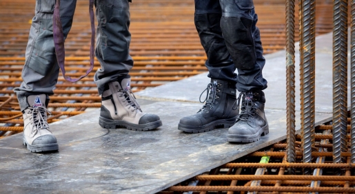 slate and black coloured work boots