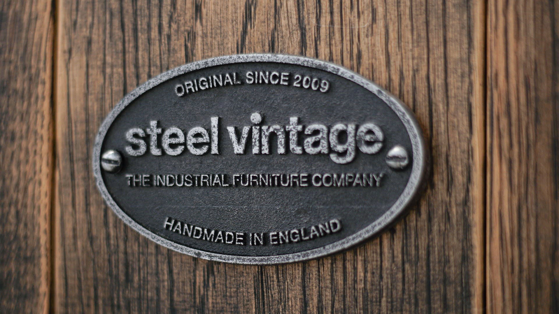 Steel Vintage grand oak desk badge closeup