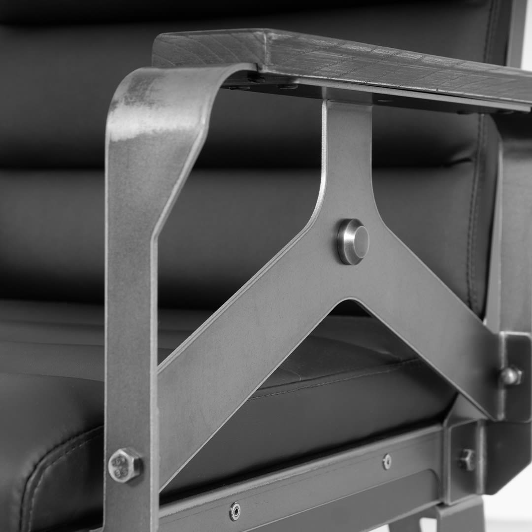 industrial style chair with black leatherette upholstery black and white