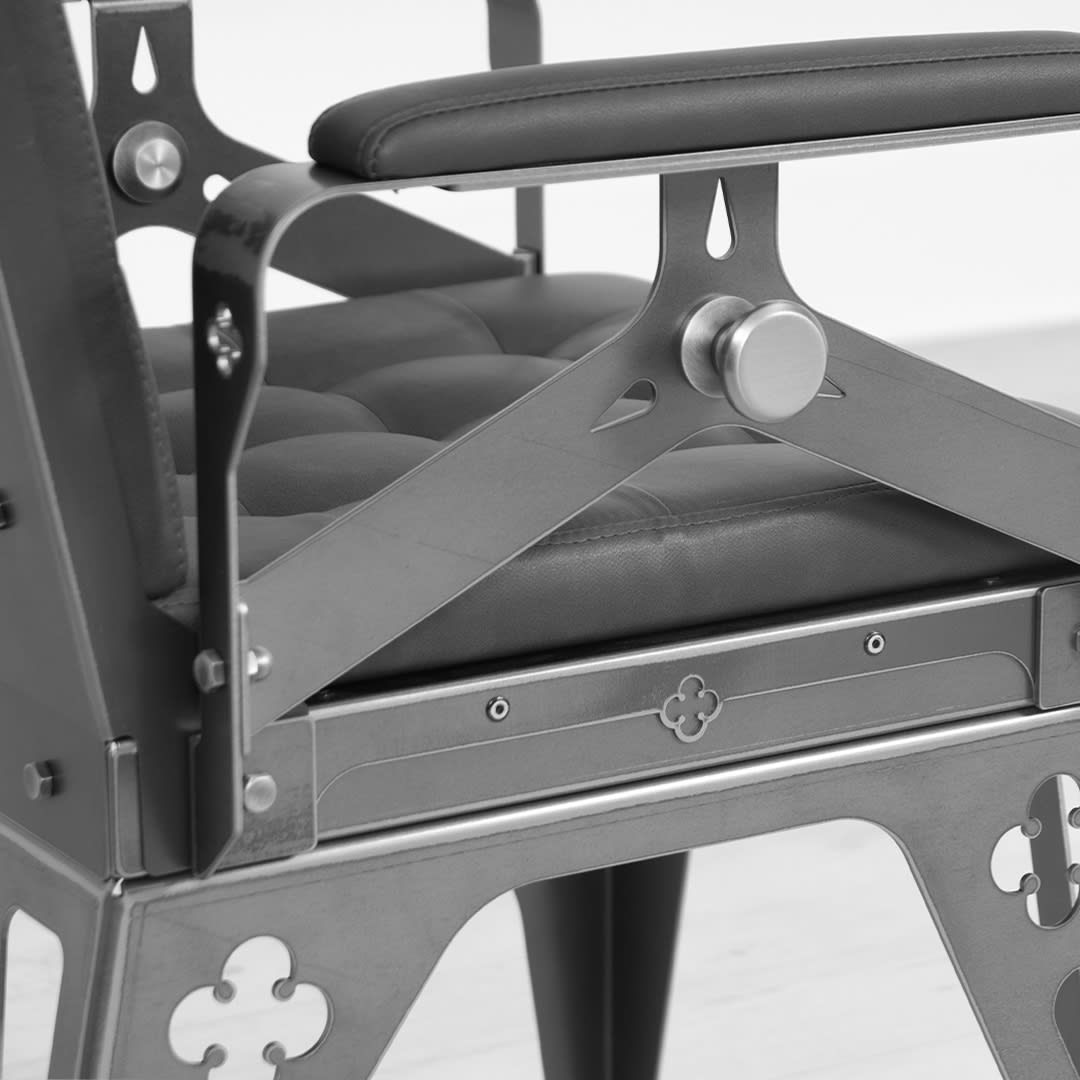 industrial style chair with black leatherette upholstery black and white
