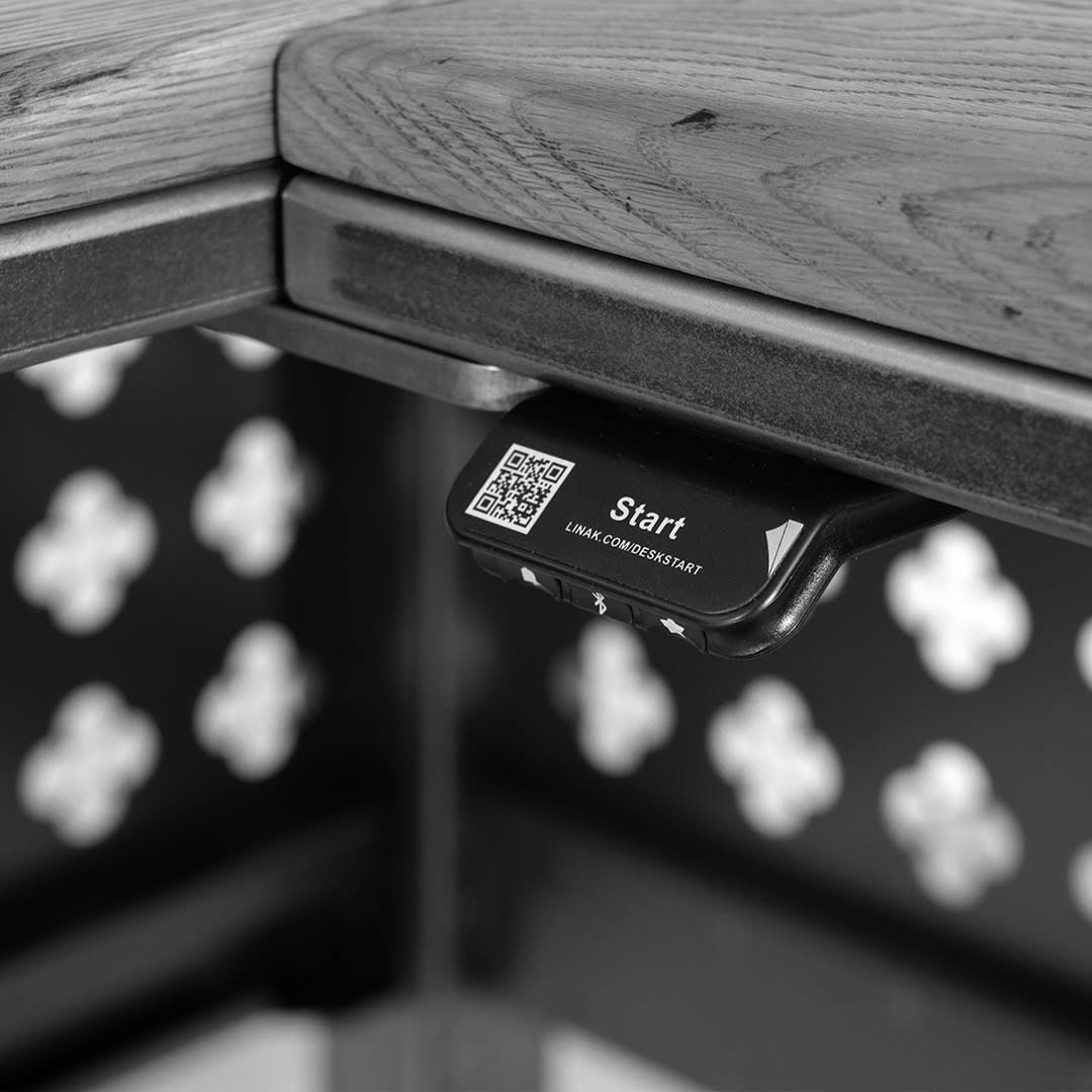 sv steel frame height adjustable corner desk with laser cut details and oak top