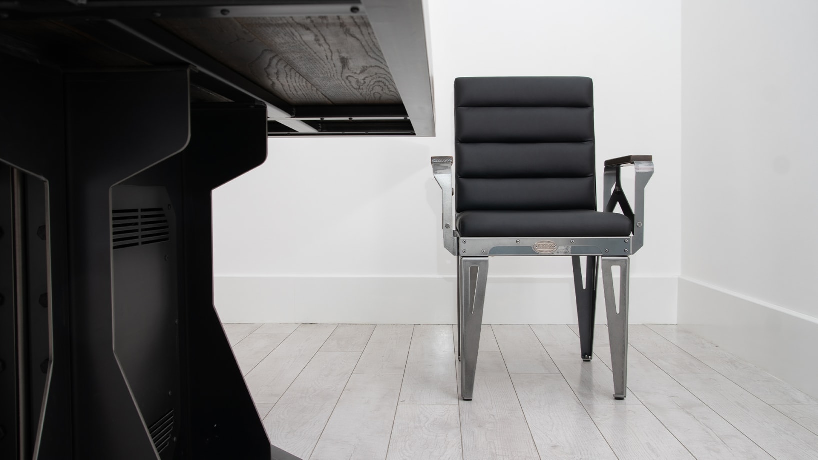 industrial style chair with black leatherette upholstery