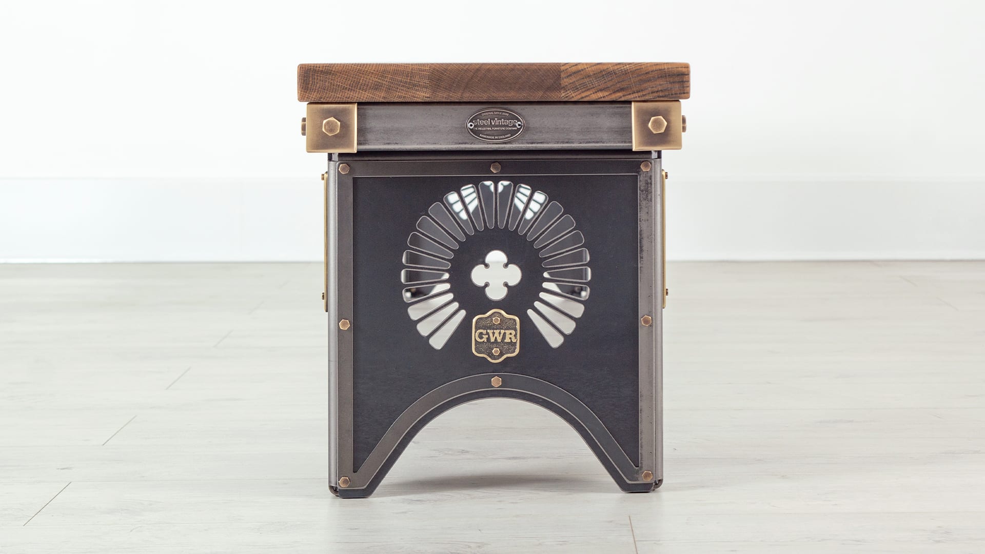 industrial style steel bench with oak top and brass details