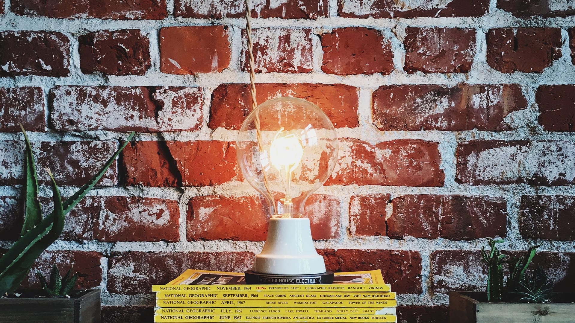 Exposed brick wall with light in front