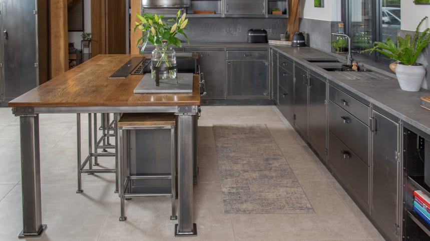 industrial style steel kitchen with island and high stools