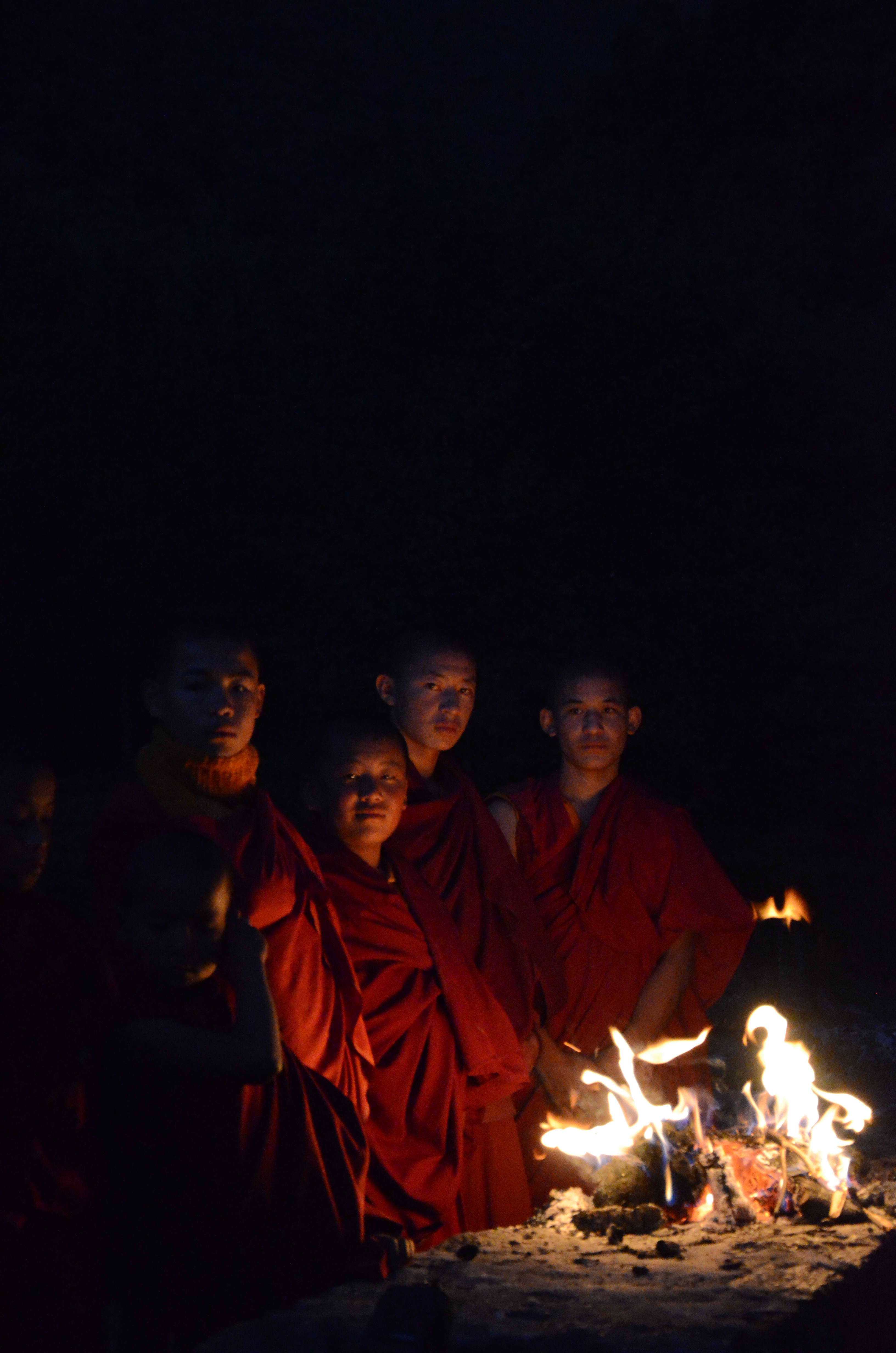 Monks, Beside a Fire