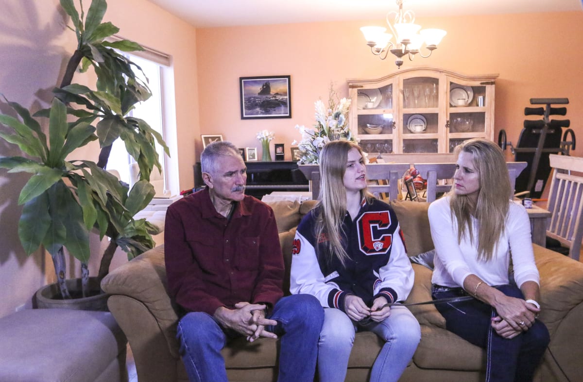 Sasha Bolla, center, responds to a questions with her parents and former basketball coaches Jim Bolla, left, and Dallas Boychuk-Bolla at their home in Las Vegas on Feb. 7, 2019. (Heidi Fang/Las Vegas Review-Journal) @HeidiFang