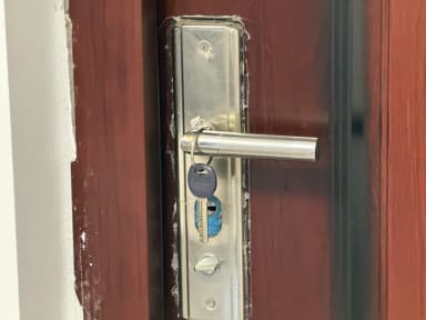 A key hung on a door handle
