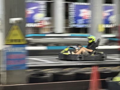 A cart racer with visible motion blurred