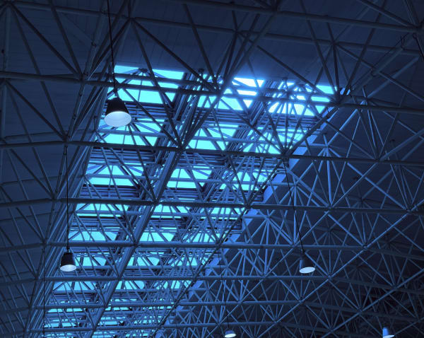 Blue shades passing through the rooftop glass wall