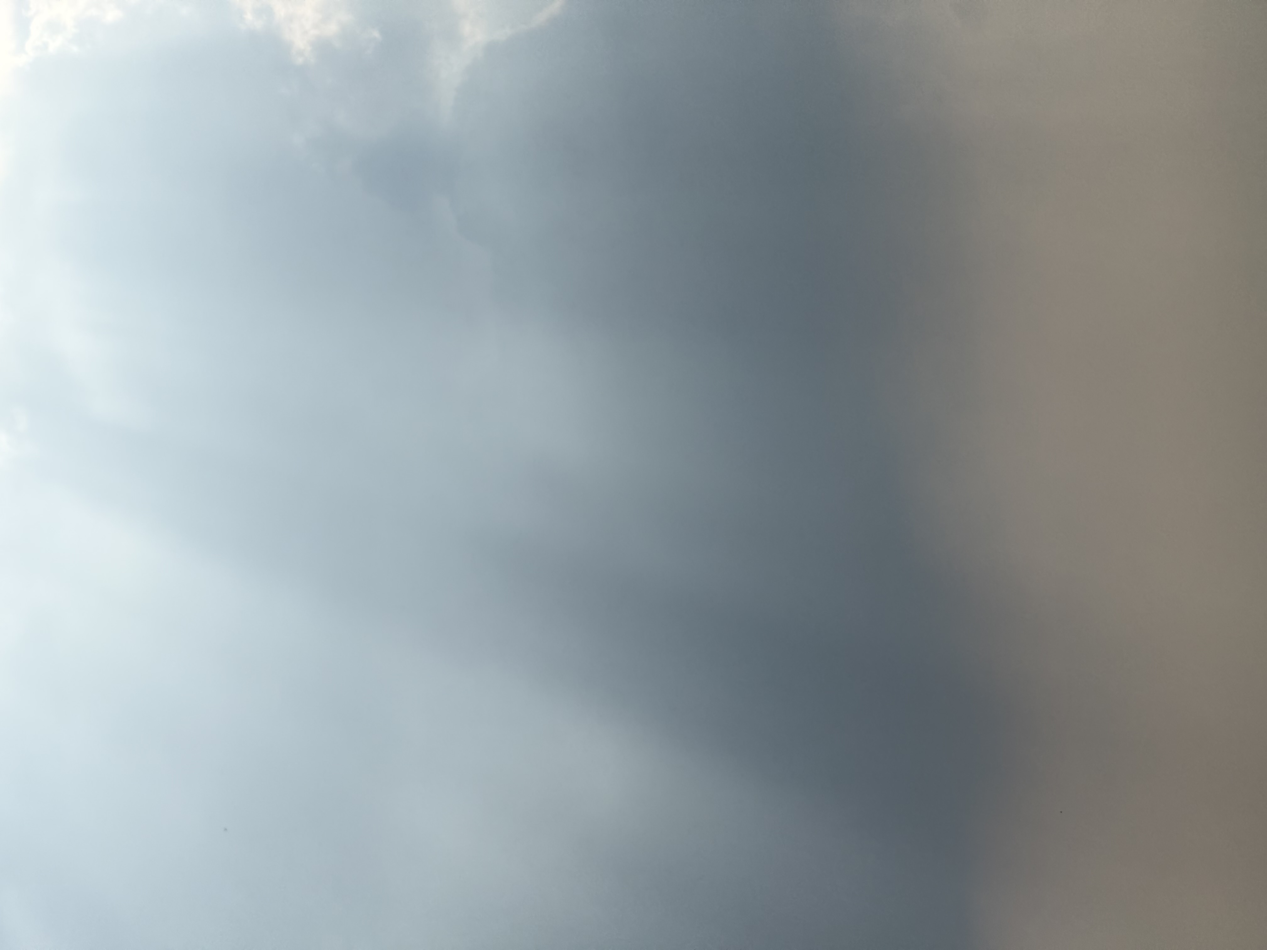 Beams of light shooting down in the sky