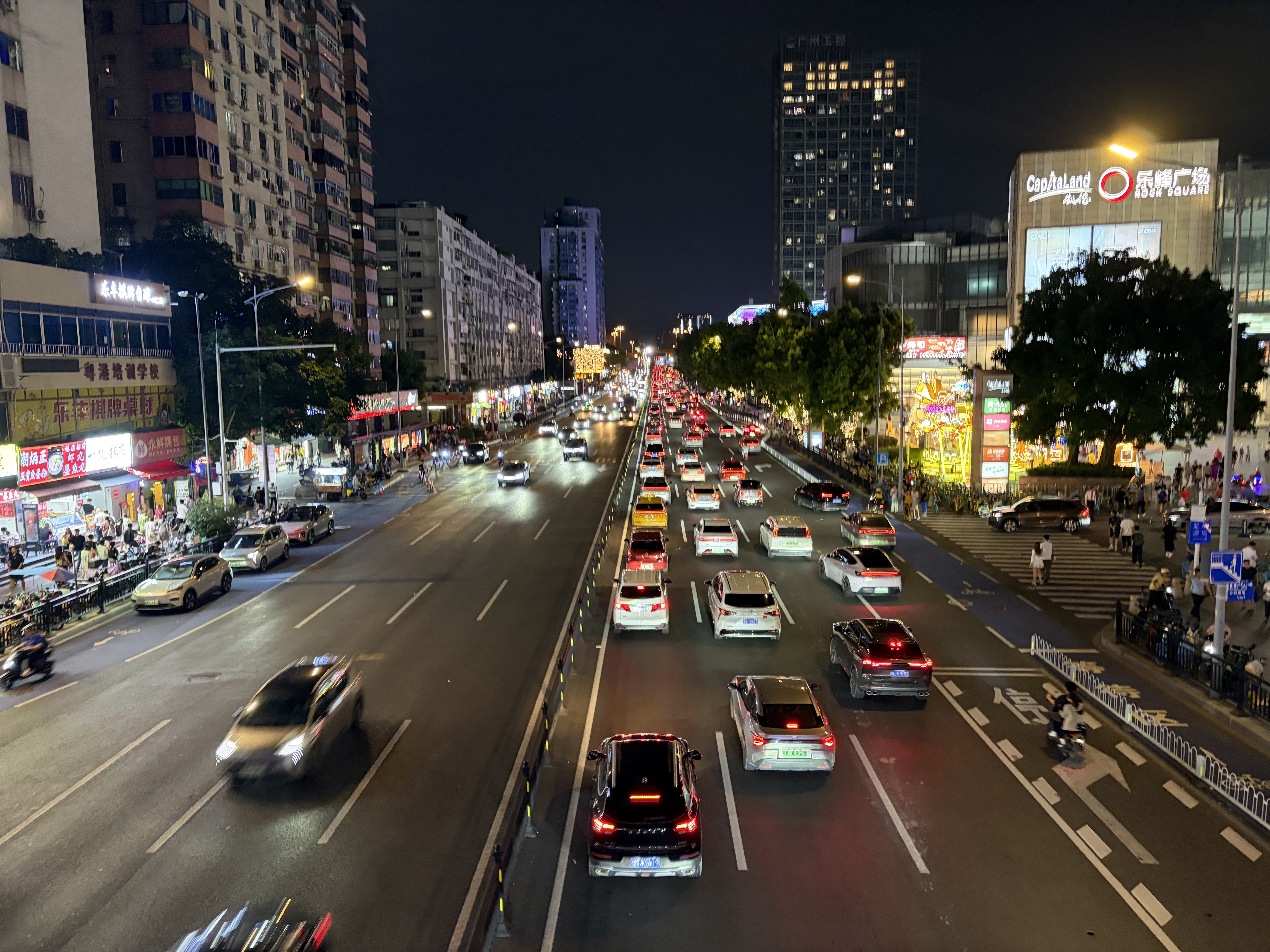 Stream of automobiles under a dark night sky