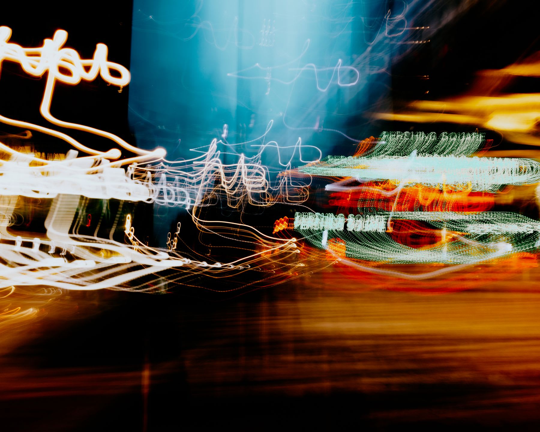 Streaks of light from blurred lamps.