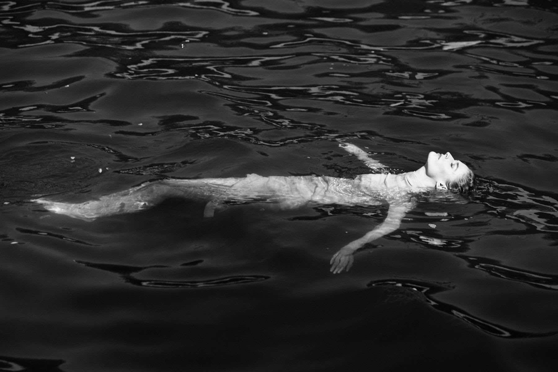 A woman swimming in a lake