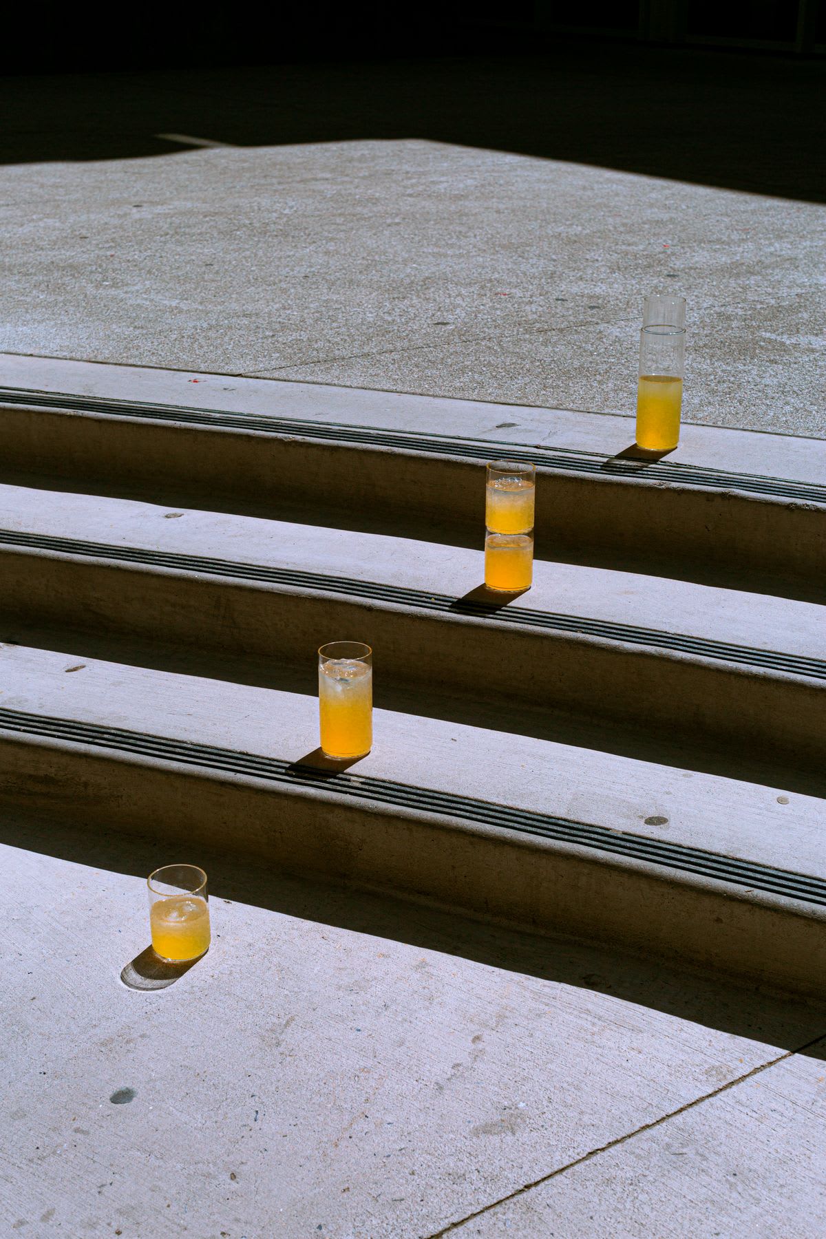 A view of some glasses full of drinks on a staircase