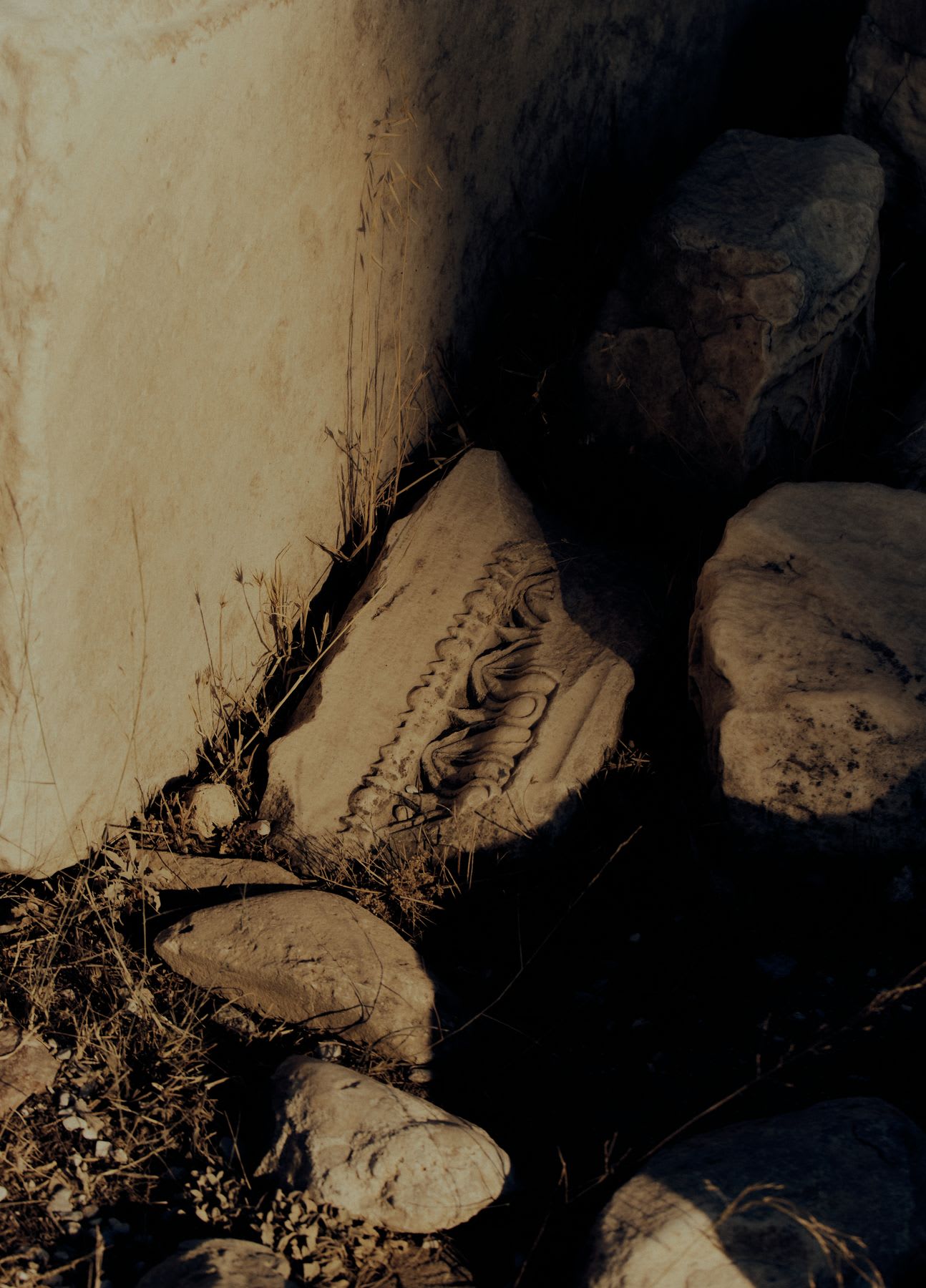 a pile of rocks and garbage sewn about