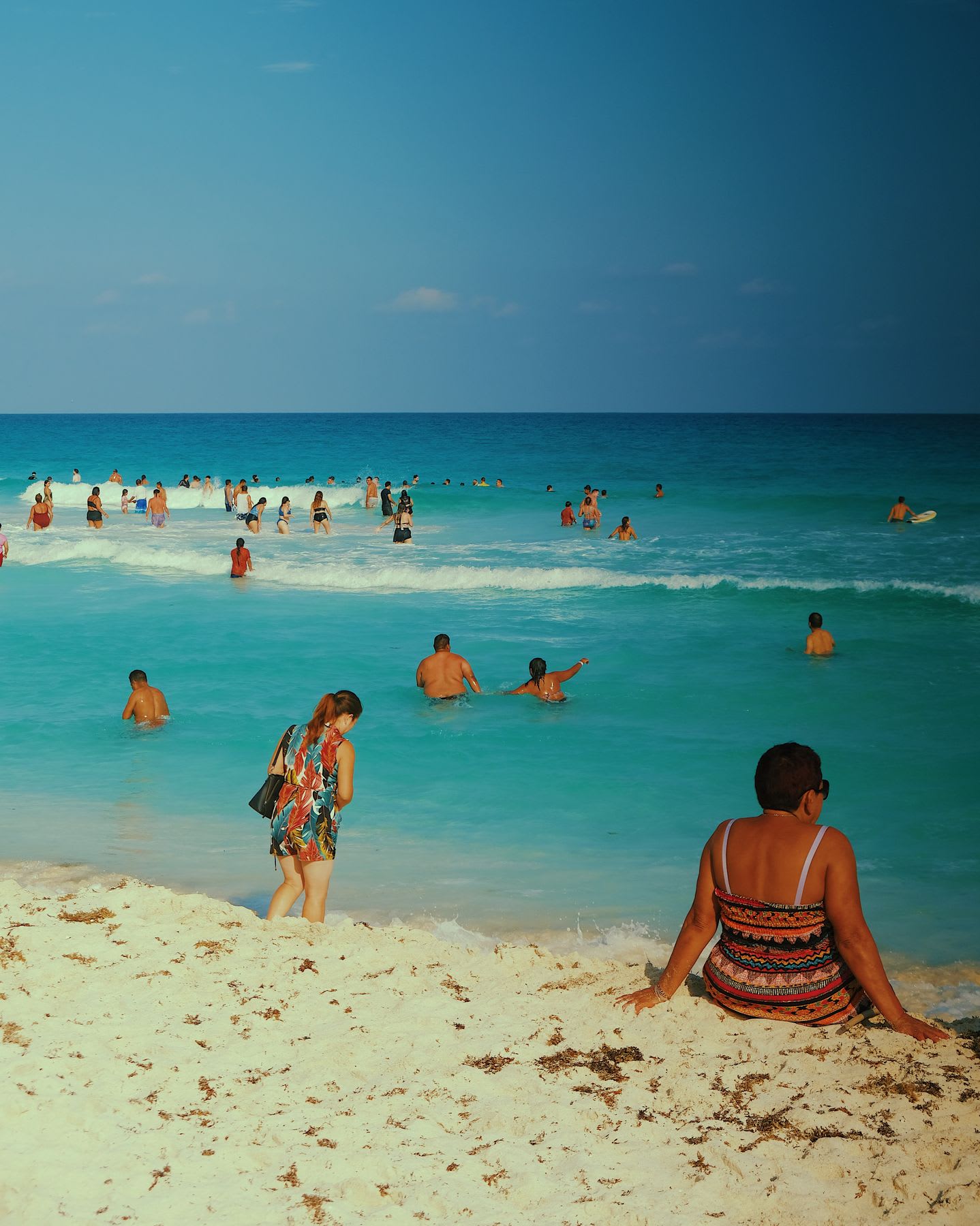 Many people enjoying the beach.