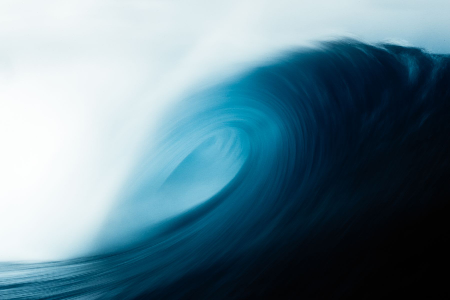 A large wave falling in the ocean