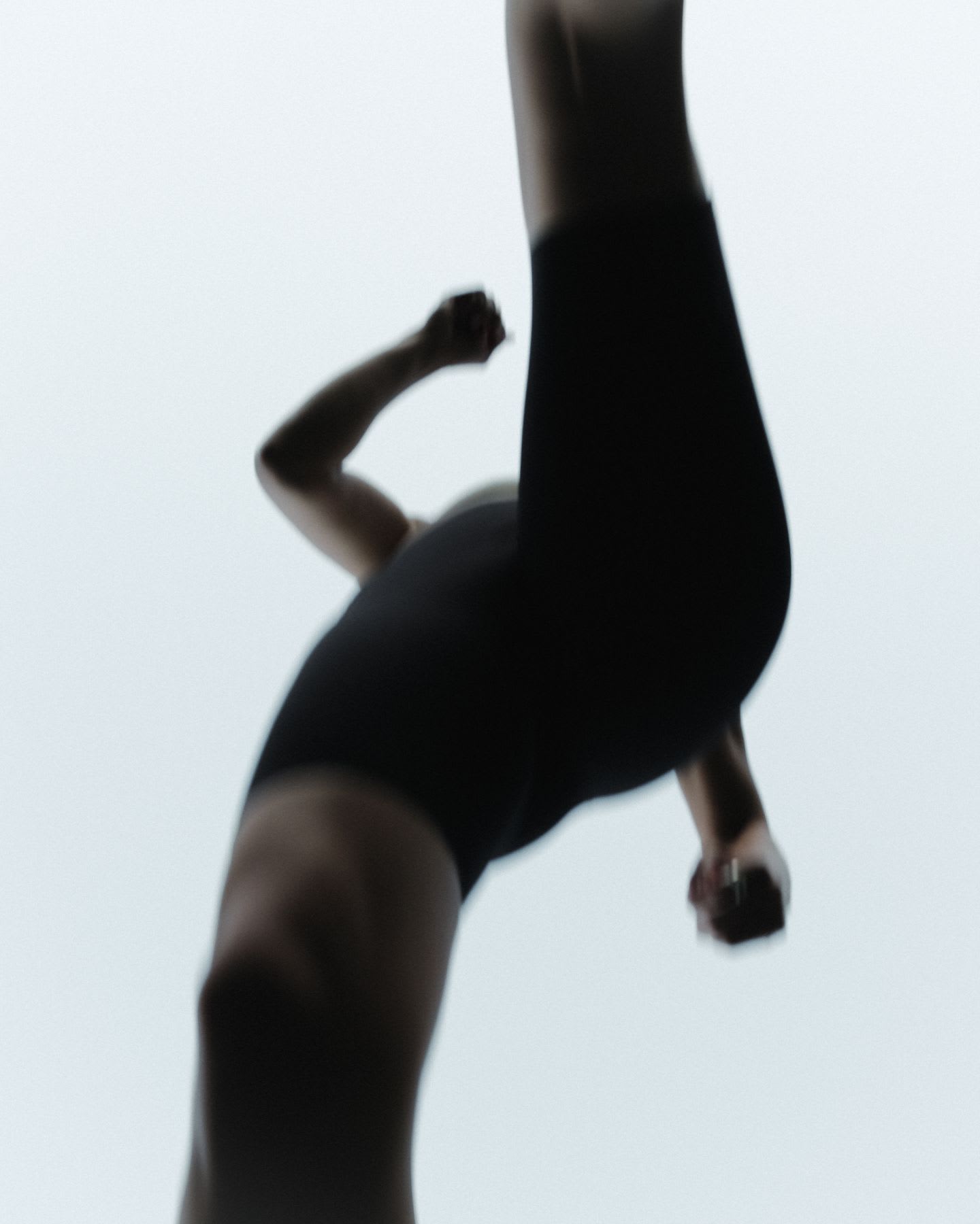 View from below the legs of a person running outdoors