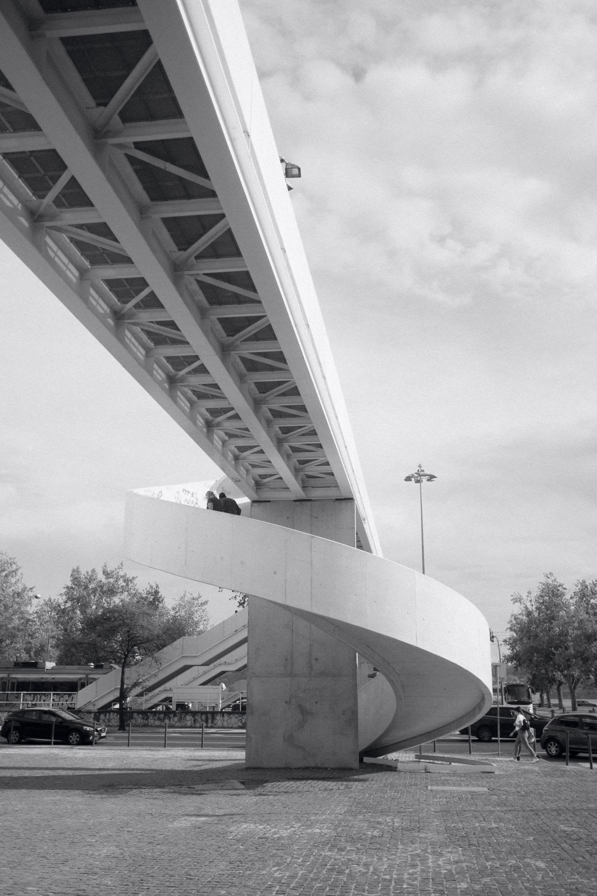 A view of a bridge outdoors in black and white.