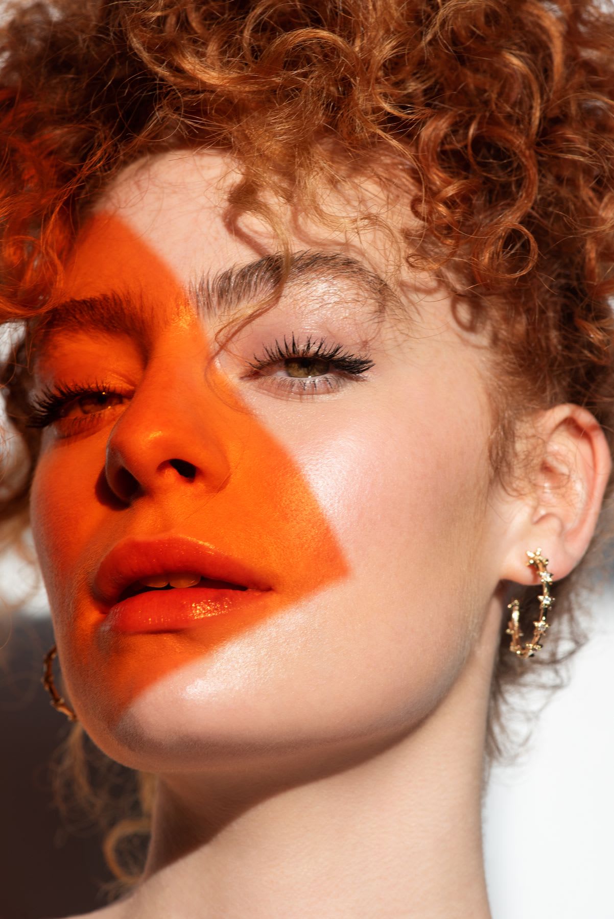 a red triangle is overlayed on a model's face