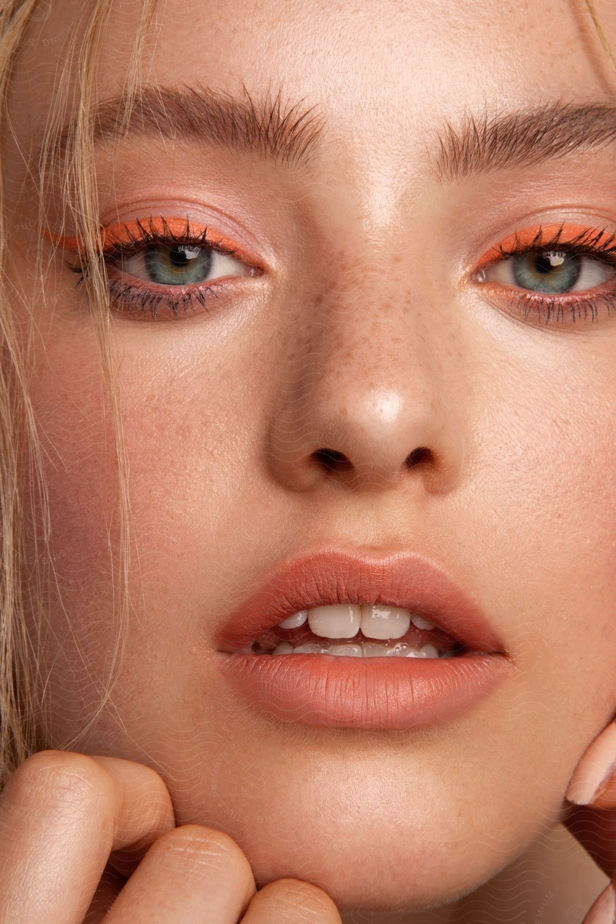 Close Up Of Face Of Woman Wearing Bright Eyeshadow