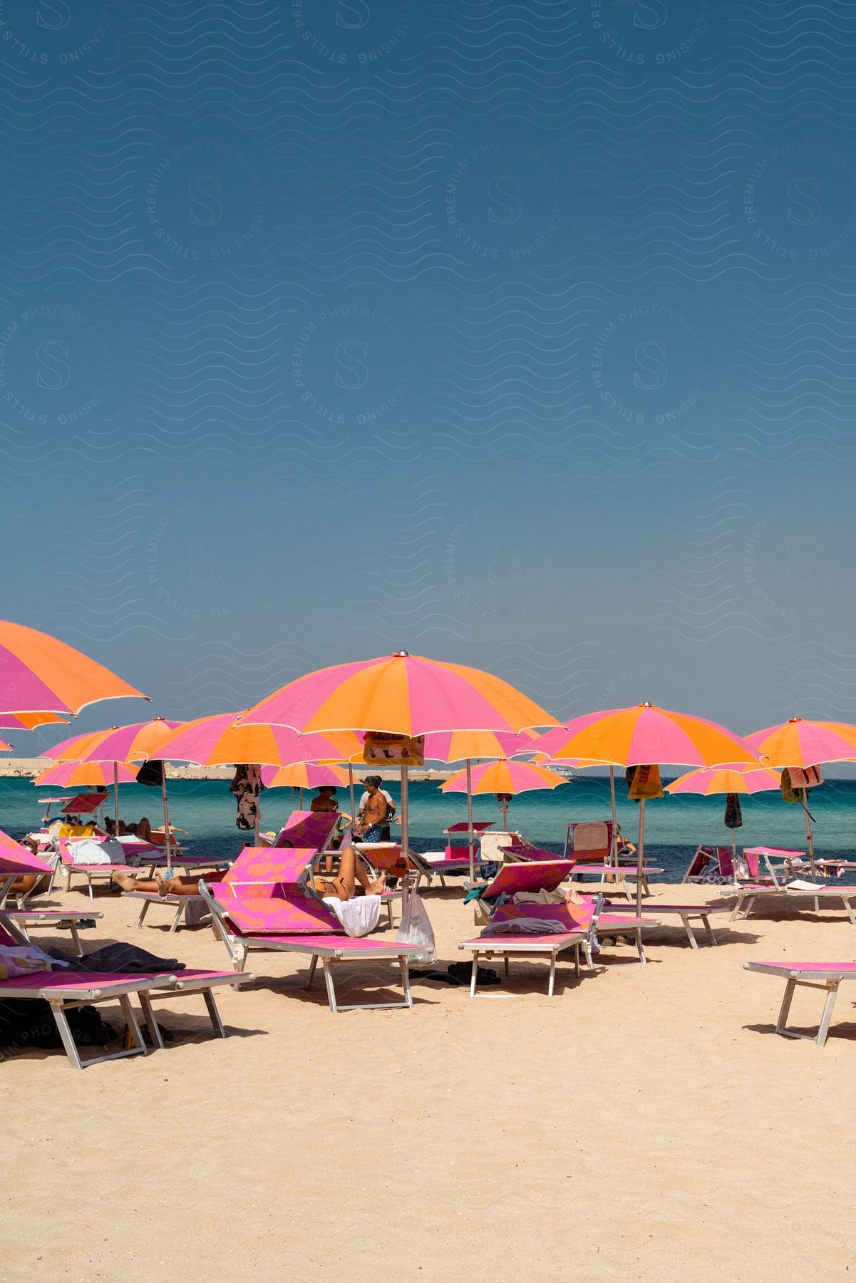 Panorama of a beach paradise with a beach umbrella and a chair.