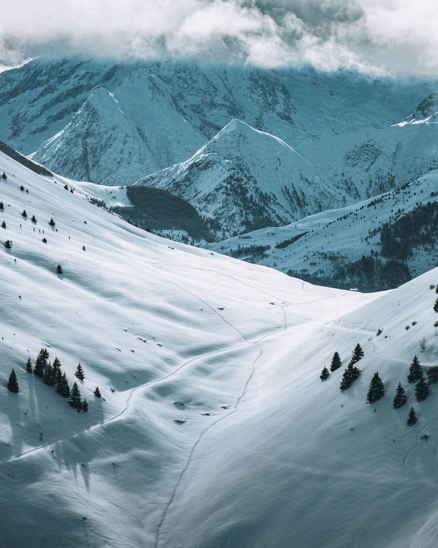 A mountainous region with all parts covered in snow.