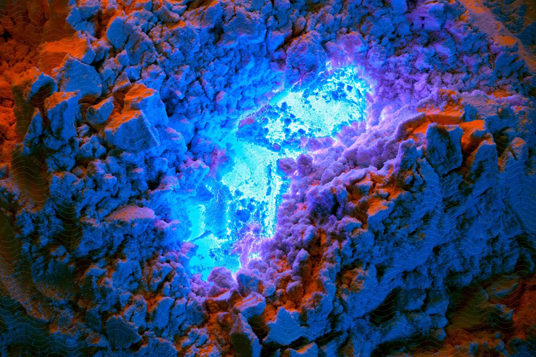a pile of blue powder with a blue light coming out of it
