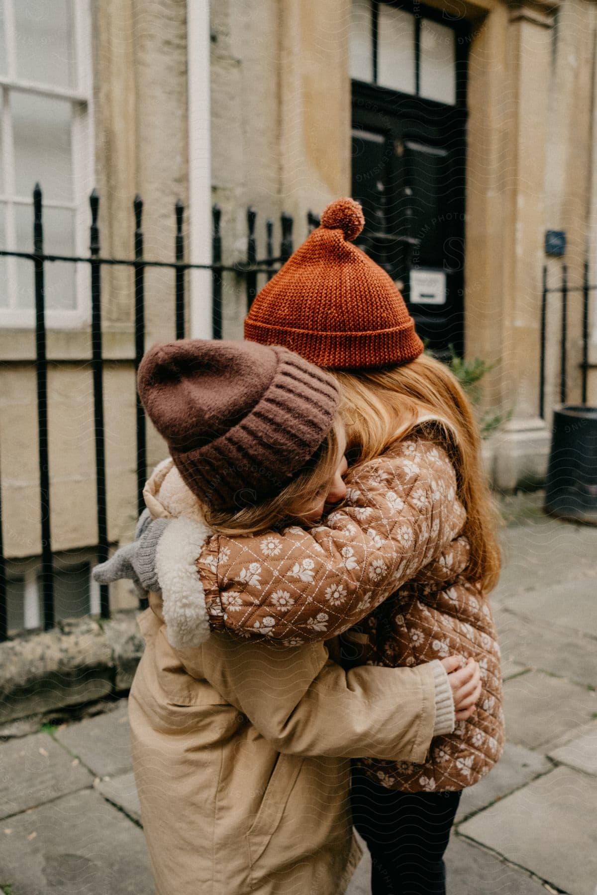 Two bundled-up people hugging.