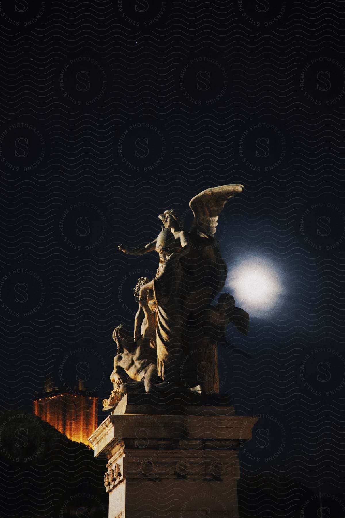 Ancient statues illuminated by the full moon.