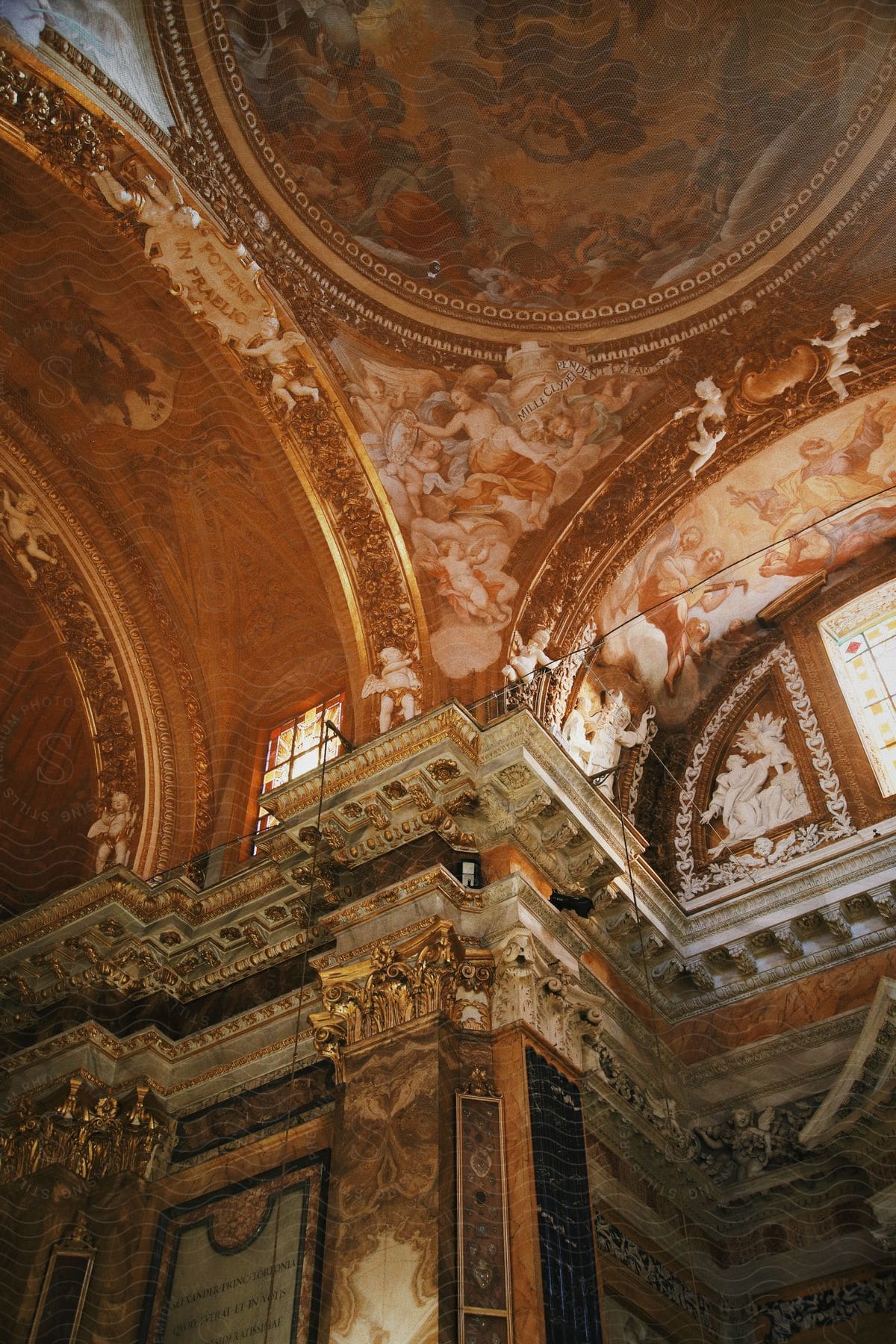 Stock photo of elaborate wall and ceiling paintings and carved wall decorations in an historic european building.