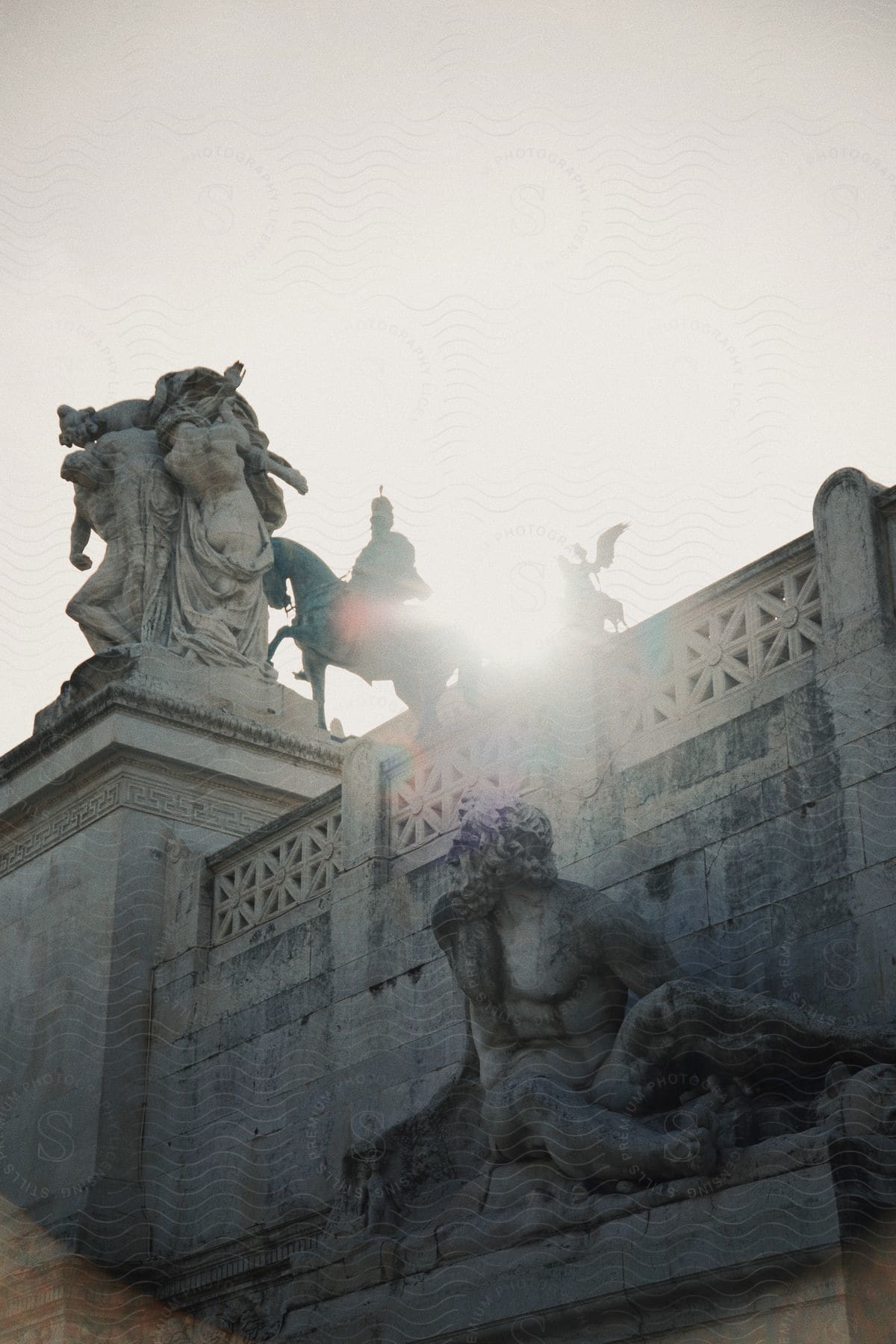 Some statues on ancient stairs outdoors.