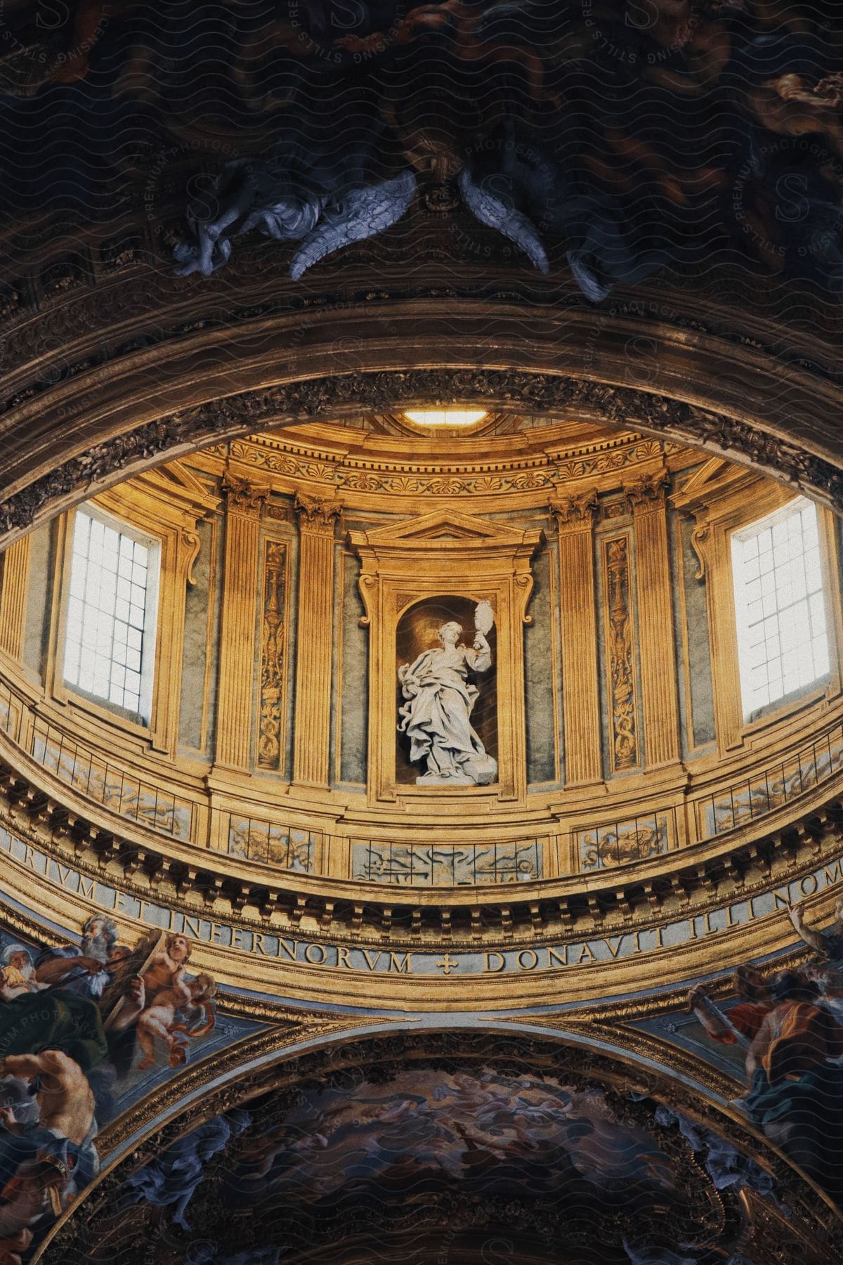The Inside Of A Church With A Statue Of A Religious Figure In The Dome