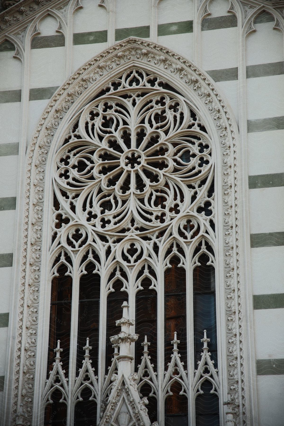 an ornate iron design covers a building's window