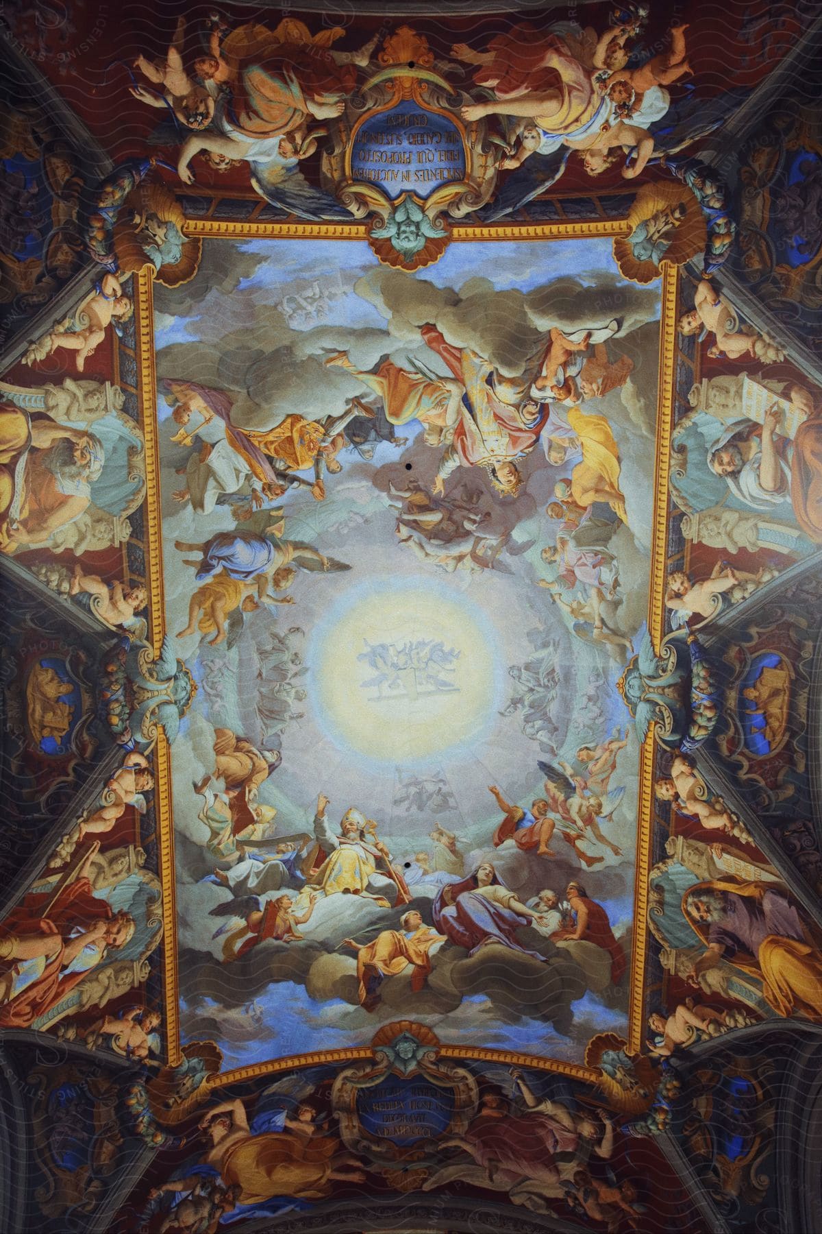 an elaborate mural is painted on the ceiling of a building