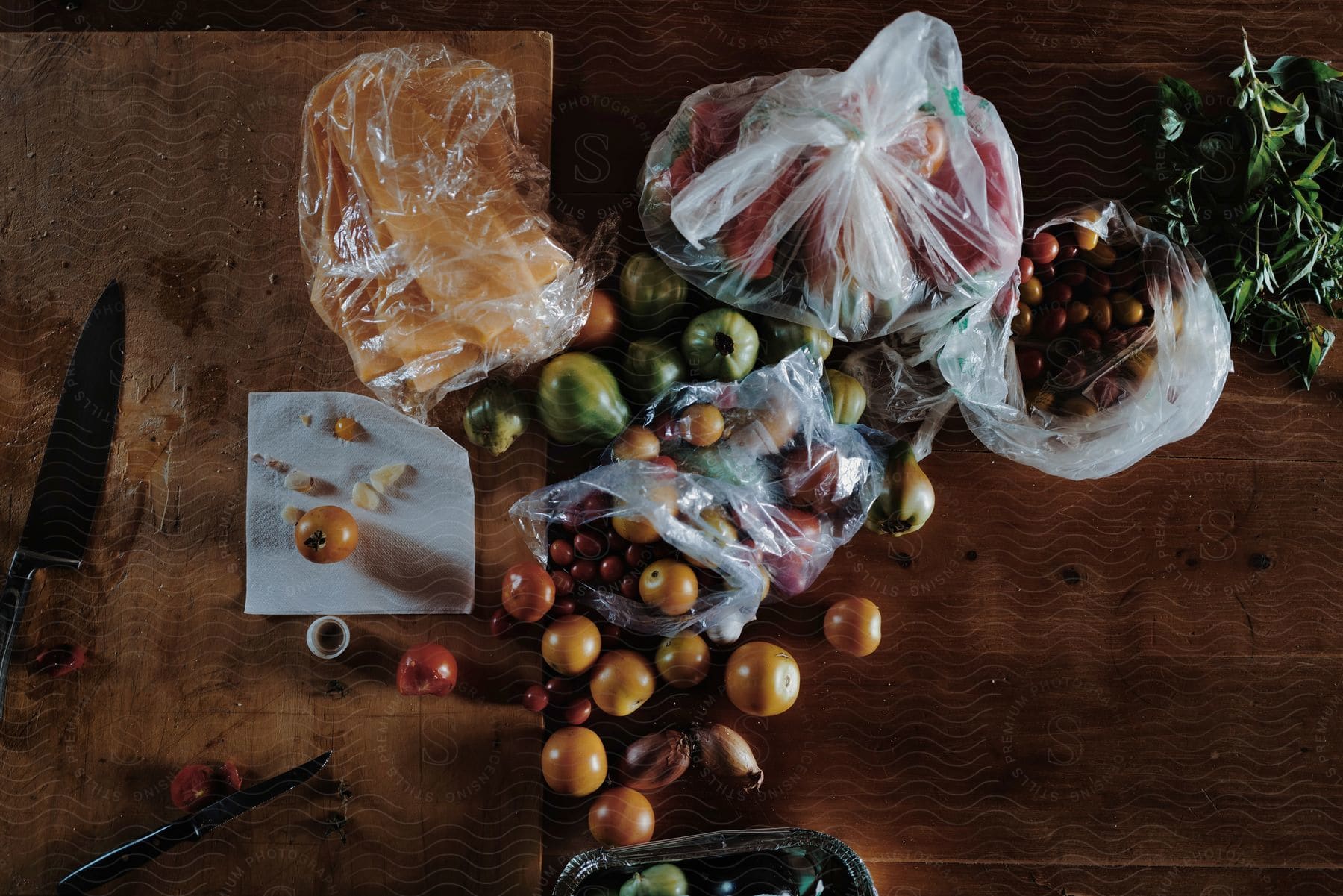 a wooden table with a bag of fruit and vegetables on it.