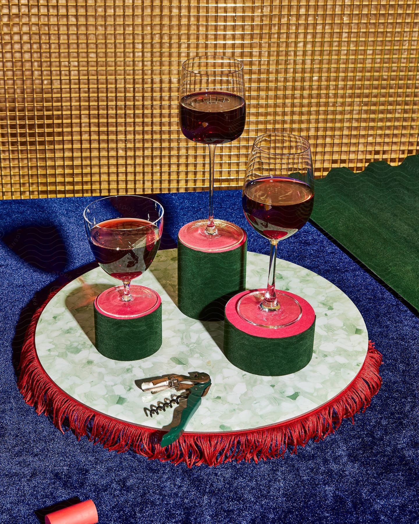 Three Glasses Of Wine Sitting On A Table