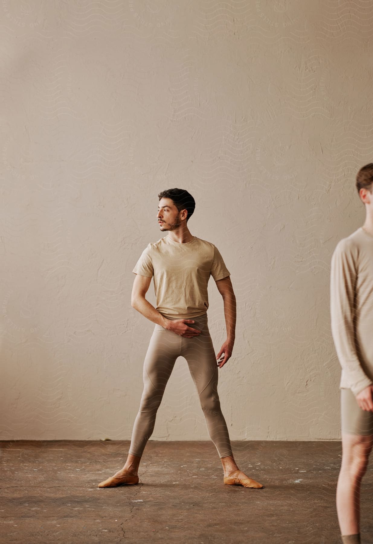 Stock photo of male ballet dancer looks to the left