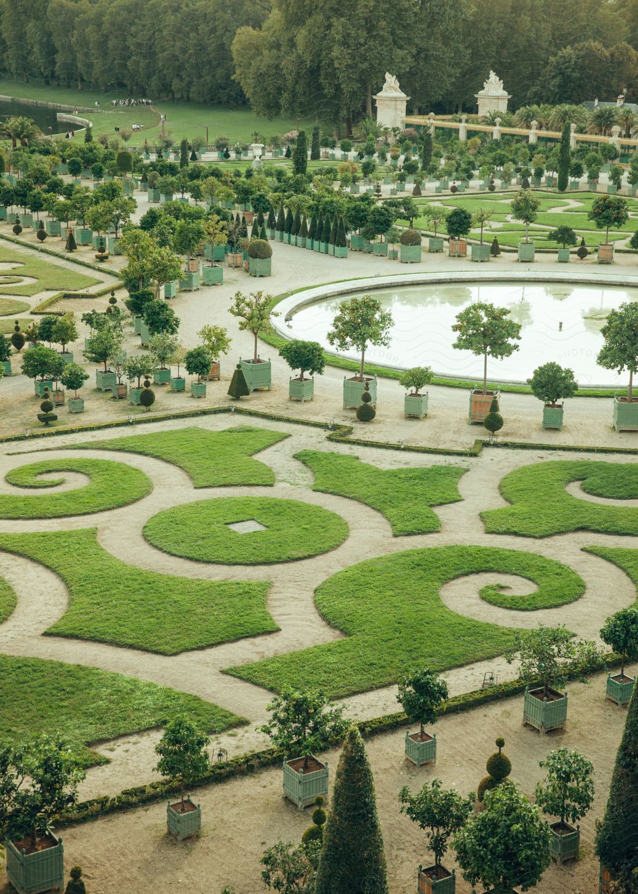 Mirror pool and the Versailles gardens outside of the Palace of Versailles in France