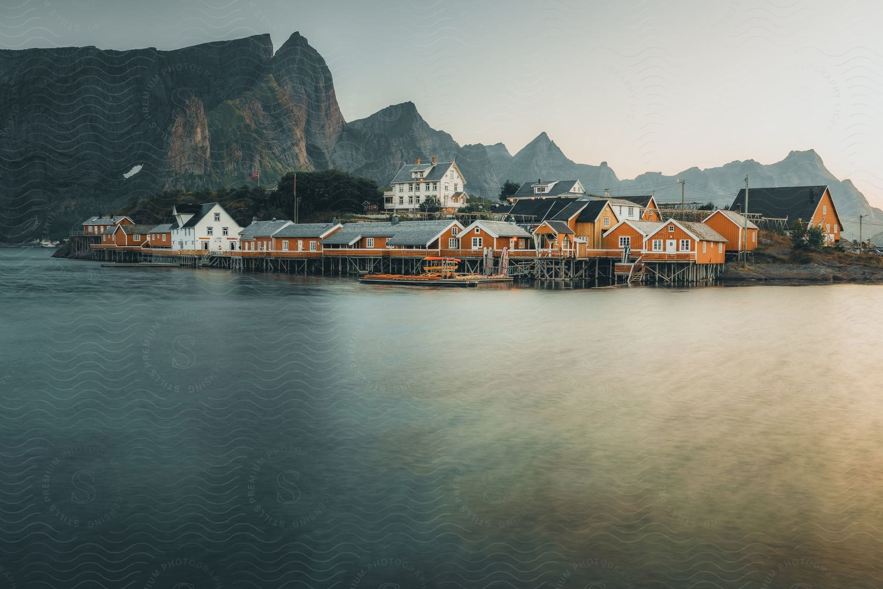 Lofoten's picturesque fishing villages, with their brightly painted wooden houses in shades of vibrant red, stand as iconic symbols of the region's stunning coastal beauty.