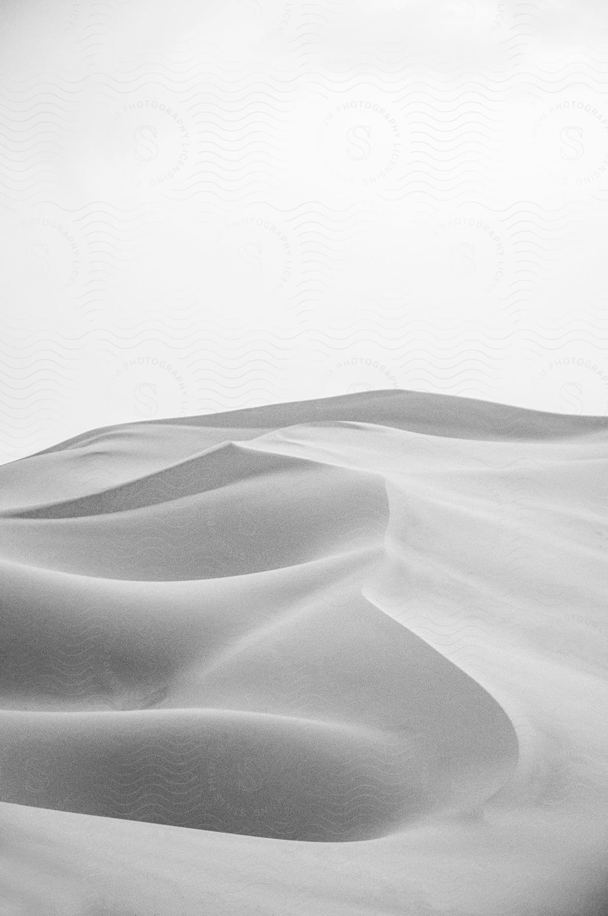 Sand dunes under a cloudy sky