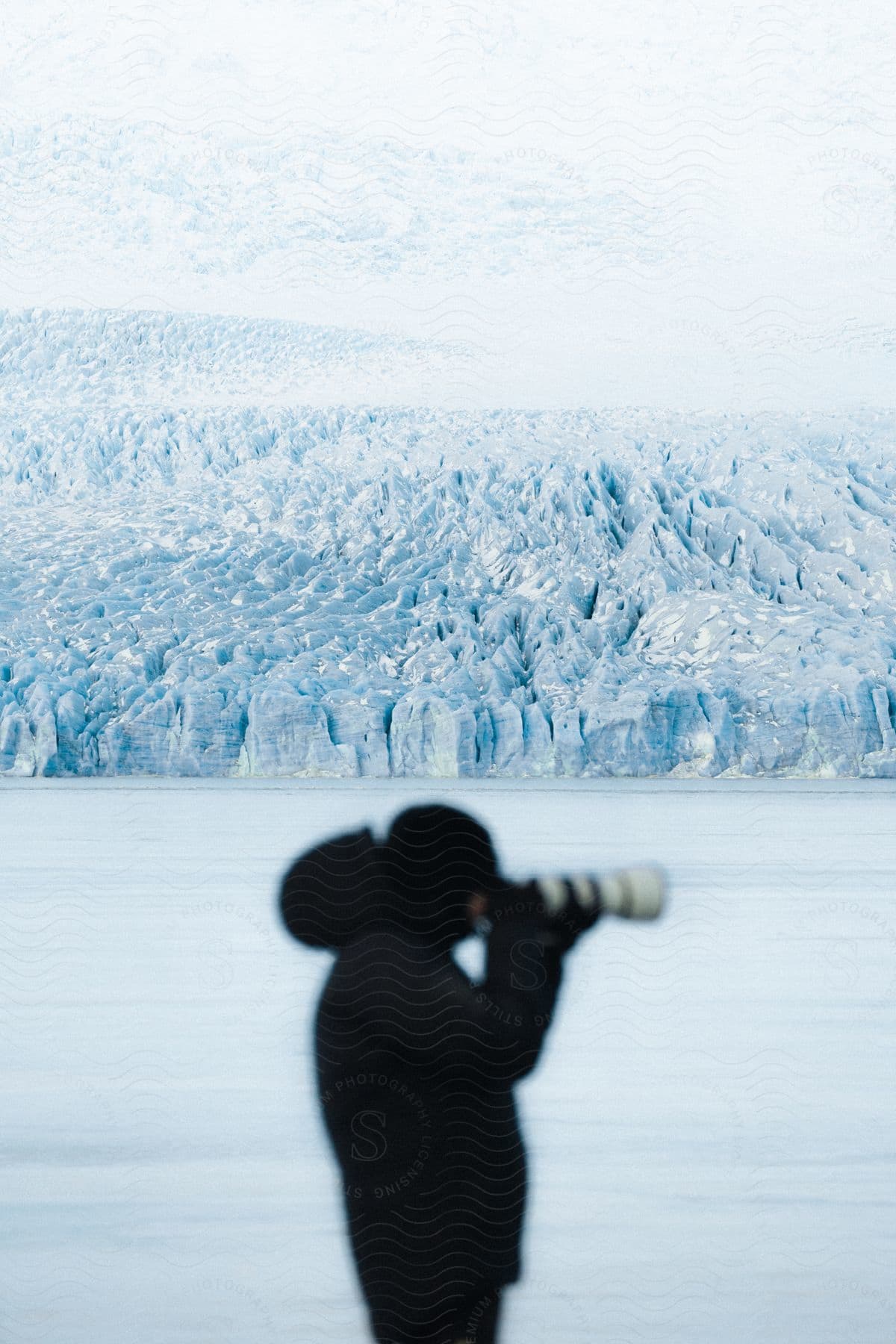 A person is taking pictures in the artic.