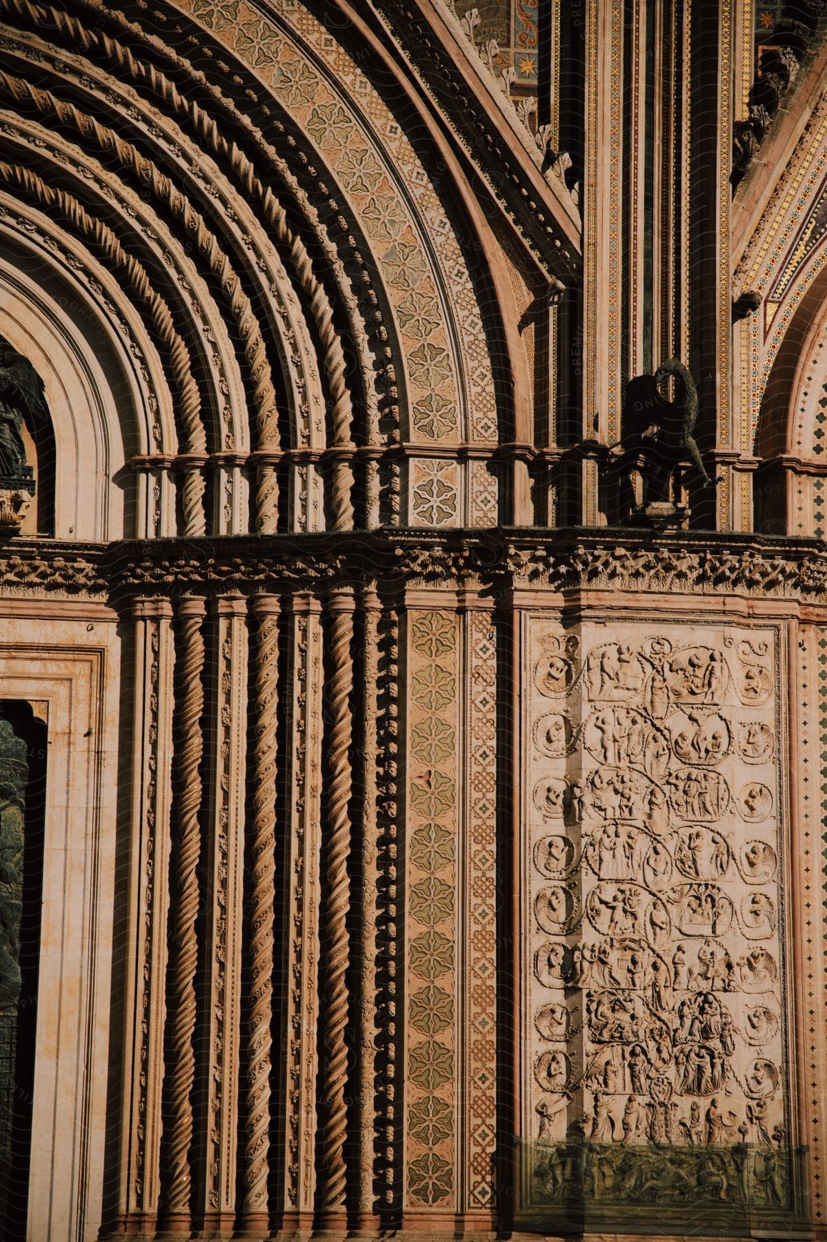 An ancient cathedral with a lot of carvings in the walls.