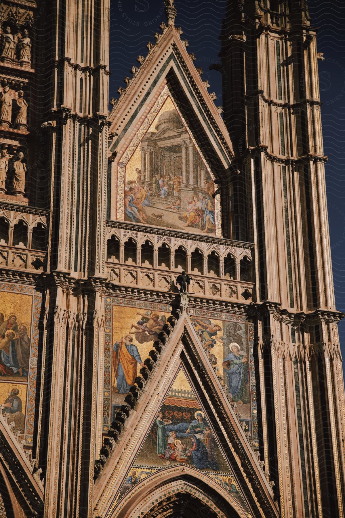 Medieval Architecture and artwork over the arch at the Cathedral at Orvieto in Umbria, Italy