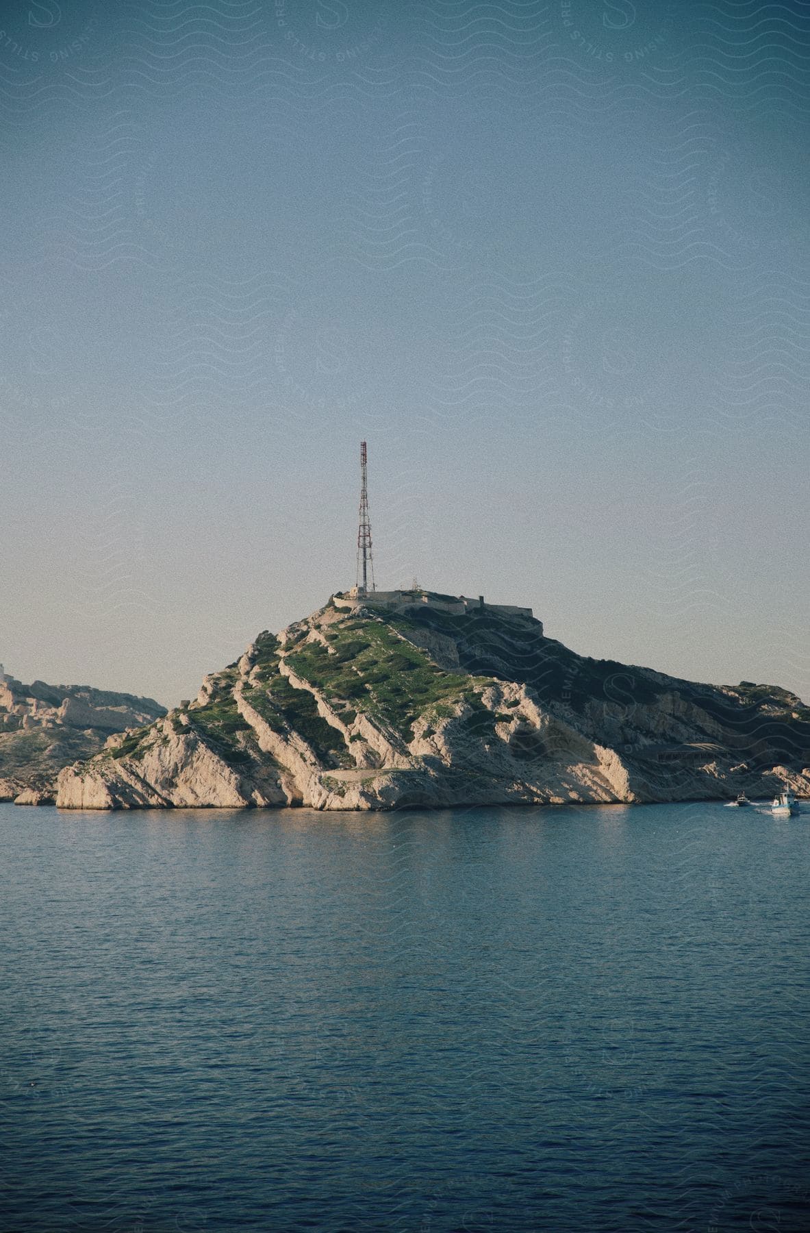 Landscape of a small island with a tower on top of it.